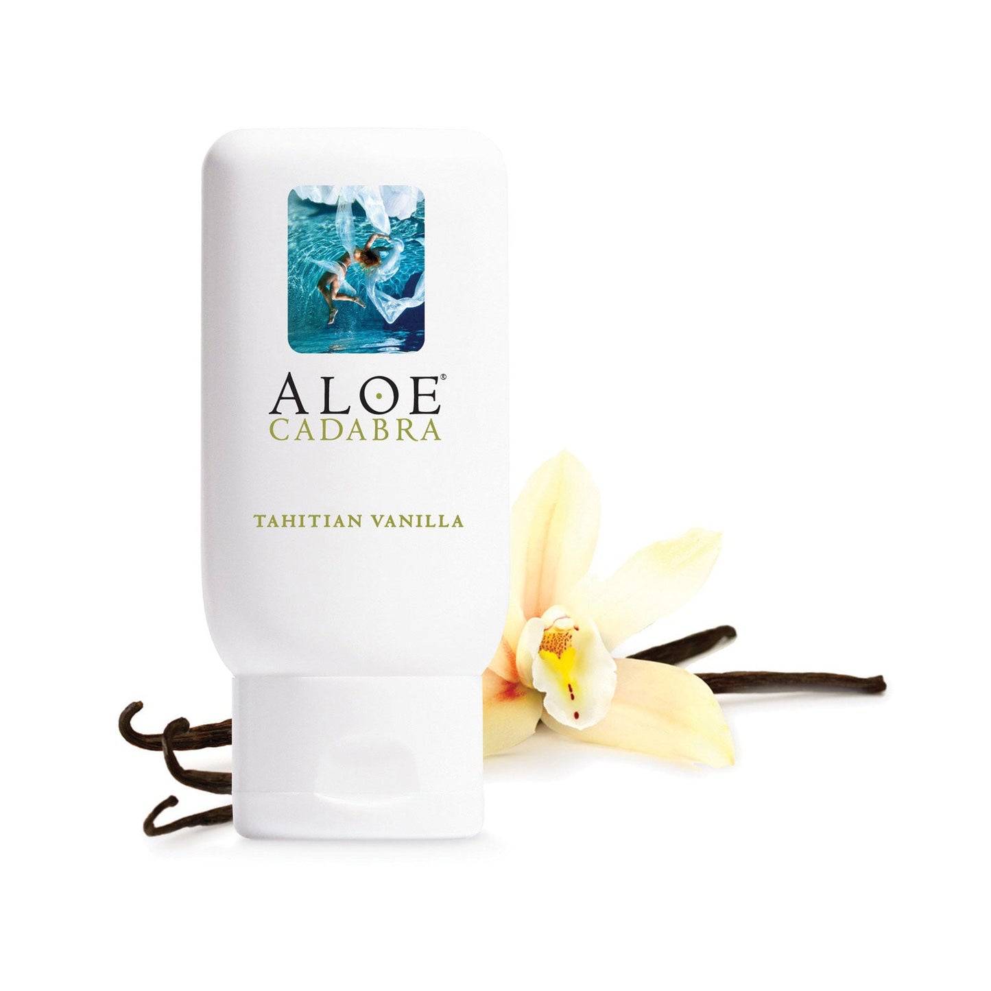 An upright bottle of Aloe Cadabra Organic Lubricant with an aloe image on the label is shown beside a vanilla flower and beans, highlighting the glycerin-free products enticing Tahitian Vanilla scent.