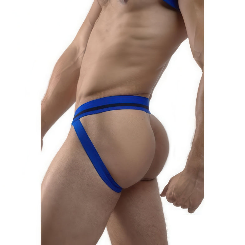 A man models the *ssTricks Jockstrap - Cruisin Cobalt, shown from the side against a white background. The design features waist and thigh straps that accentuate and reveal the buttocks, adding a bold statement to his look.