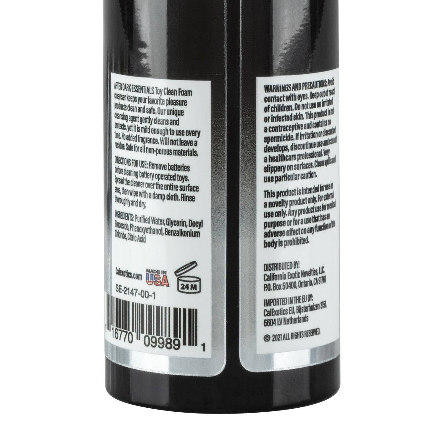 A close-up of the After Dark Essentials Foam Toy Clean by California Exotic Novelties shows warnings, precautions, ingredients, and usage instructions. Highlights its water-based formula, distribution info, barcode, Made in USA label, 24M shelf life symbol, ensuring safe foaming toy cleaning.