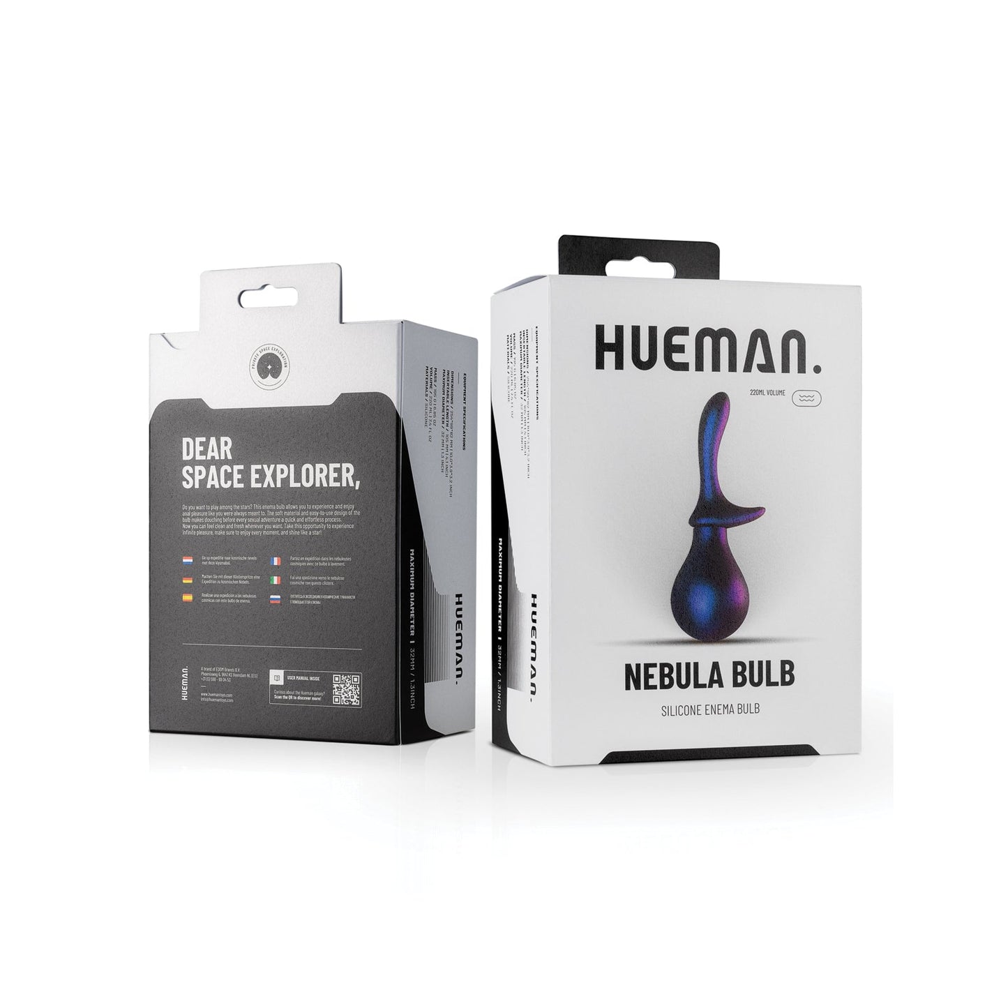 Two product boxes are displayed. The left box features Dear Space Explorer with multilingual details, while the right showcases the vibrant Hueman Nebula Anal Douche Bulb from the Hueman collection, a colorful silicone enema bulb for anal cleaning enthusiasts.