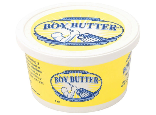 A white and yellow Boy Butter Original container features a strong figure churning butter, with Original above and Personal Lubricant below. Enhanced with coconut oil, this 8 oz product offers a unique variation on traditional silicone lubricants.
