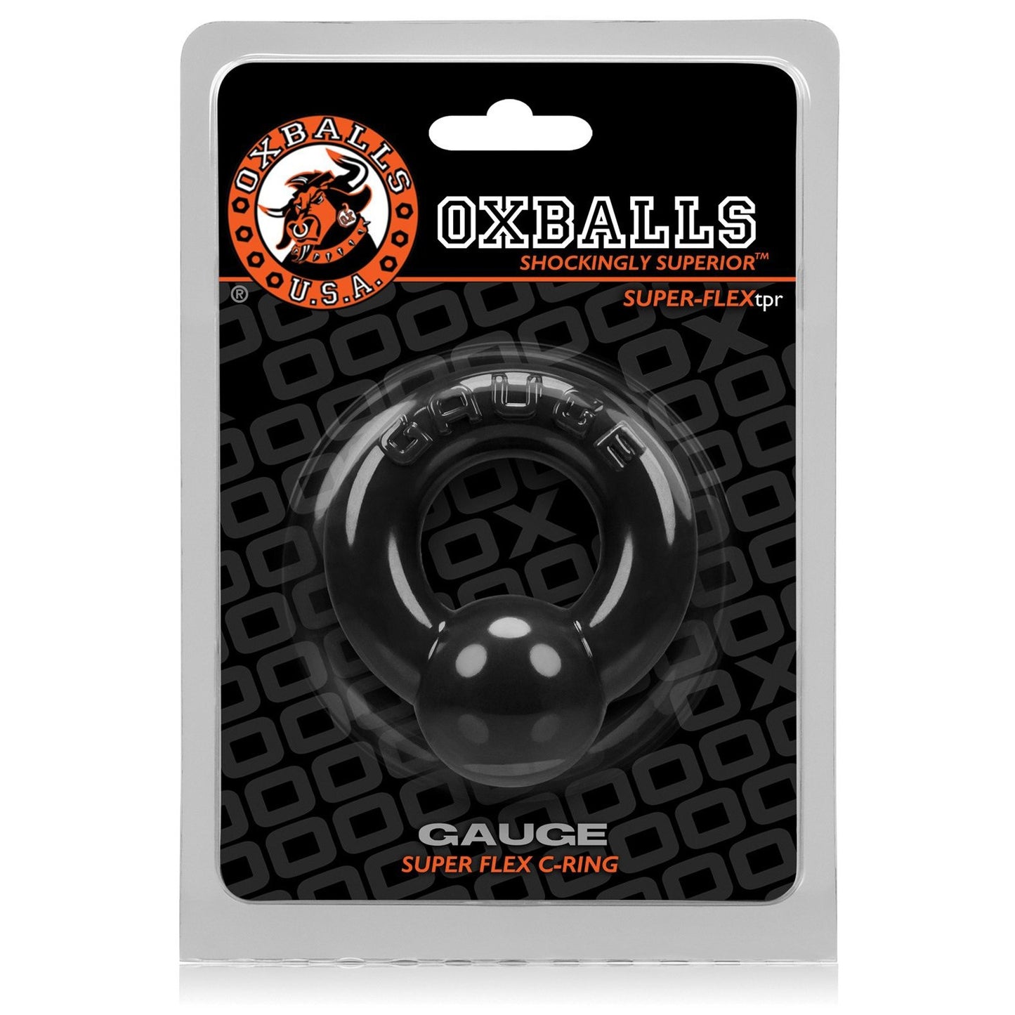 The Oxballs Gauge Cockring is displayed in transparent packaging, featuring a sleek black circle made from flexible and comfortable SuperFLEXtpr. The packaging backdrop prominently showcases the Oxballs logo alongside the slogan Shockingly Superior.