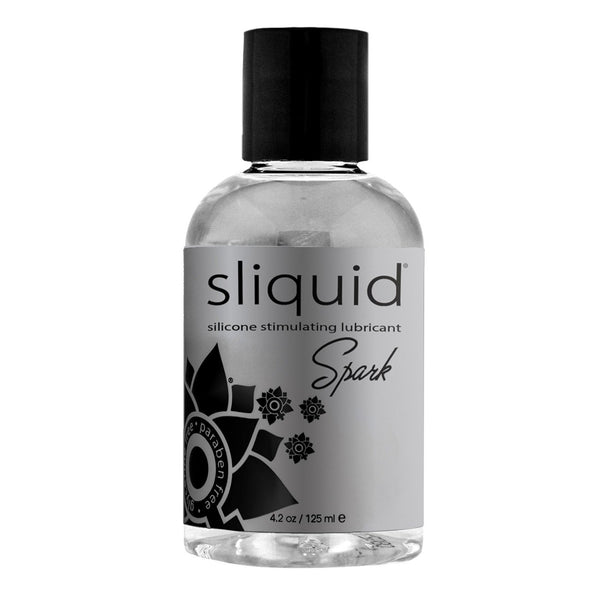 A clear bottle of Sliquid Naturals Spark Booty Buzz silicone-based, hypoallergenic lube features a black cap, gray label with black floral designs, and highlights its vegan-friendly 4.2 oz (125 ml) volume.