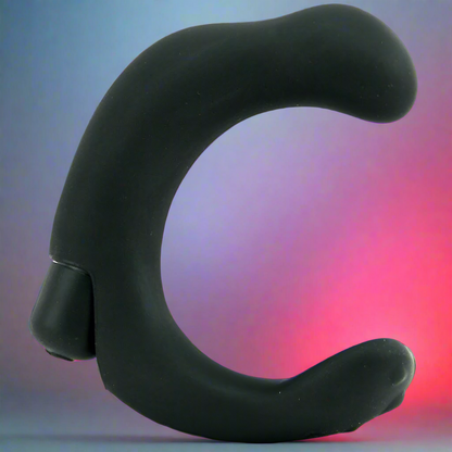 The P-Rock Prostate Massager by California Exotic Novelties is a sleek, C-shaped black vibrator on a gradient blue-pink background. Its waterproof design features a smooth surface with a small base or button, hinting at its powerful capabilities.