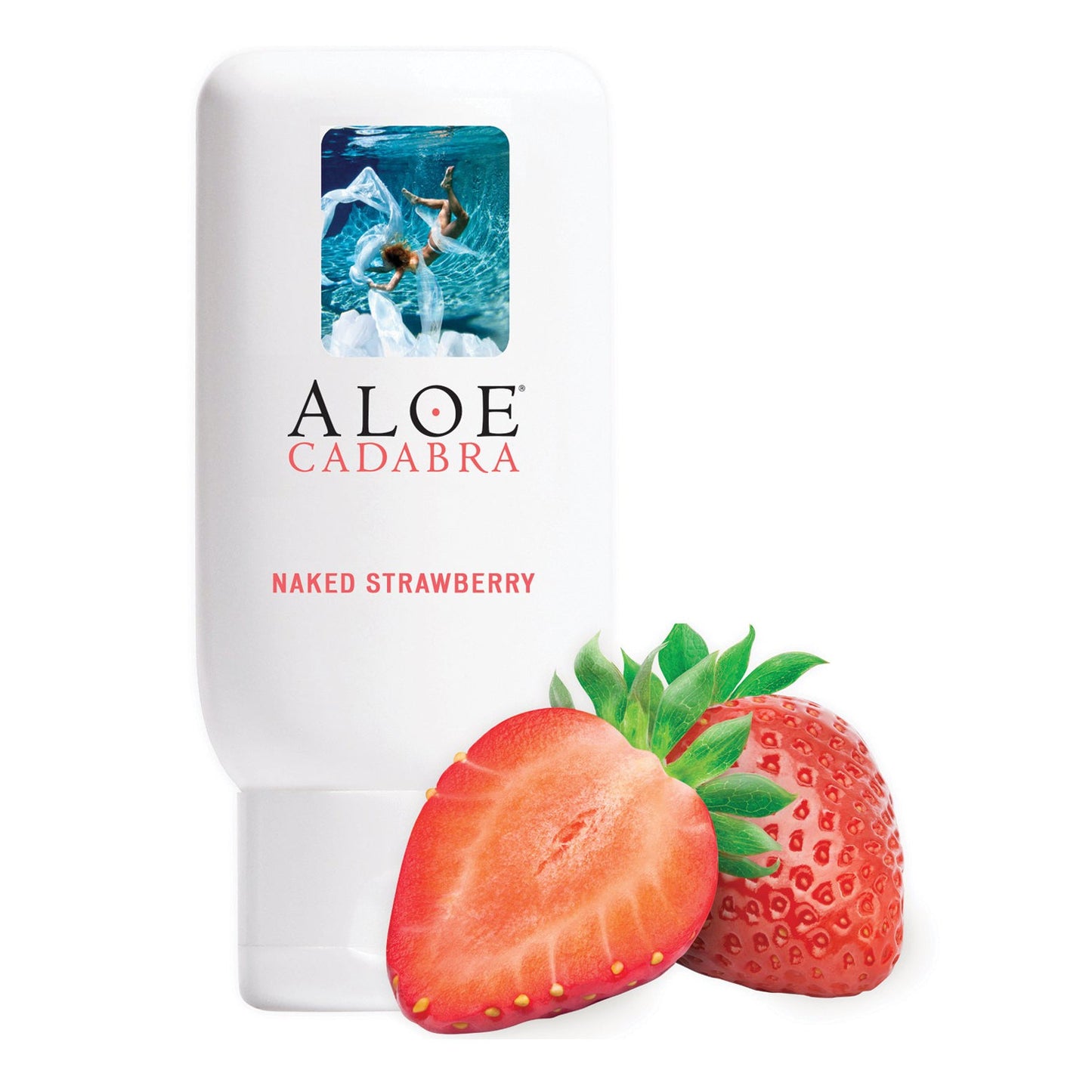 A bottle of Aloe Cadabra Organic Lubricant, Naked Strawberry scent, is shown on a white background with two strawberries—one whole and one sliced—in the foreground. The bottle features a mini image of a swimmer, emphasizing its glycerin-free aloe vera base.