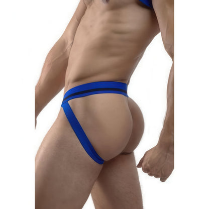A man models the *ssTricks Jockstrap - Cruisin Cobalt, shown from the side against a white background. The design features waist and thigh straps that accentuate and reveal the buttocks, adding a bold statement to his look.