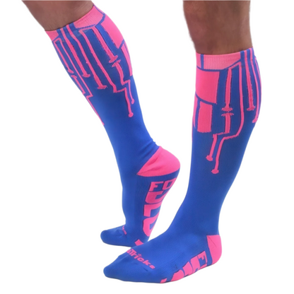 A person wears *ssTricks CyberTech Socks Neon Pink & Blue—knee-high socks with futuristic tech-inspired blue and neon pink designs, featuring bold text on the soles and toes.