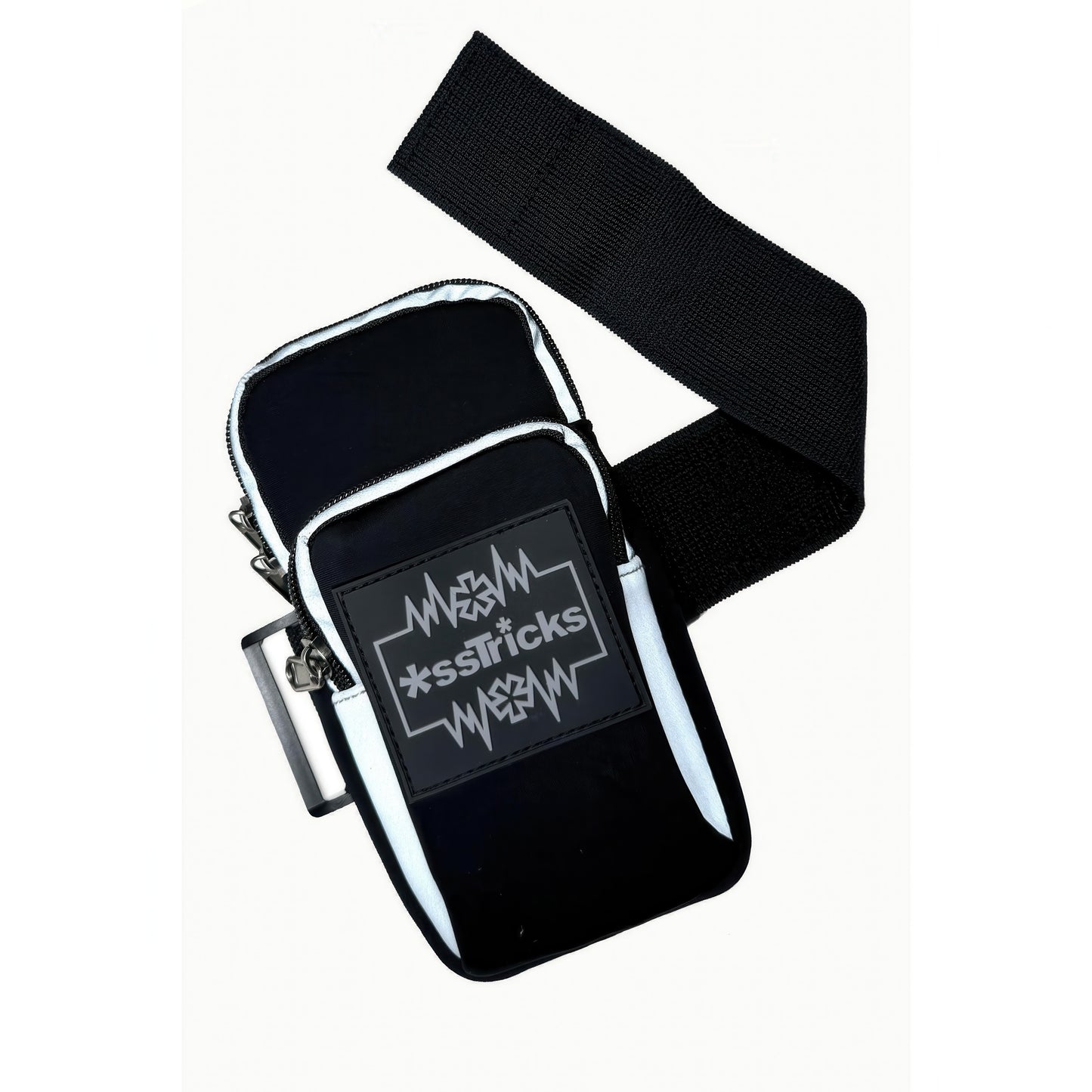 The EKG Arm Bag in Black by *ssTricks is a small, water-resistant neoprene bag with a wide black strap. It features a front rectangular patch with white jagged lines and stylized *ssTricks text for everyday protection.