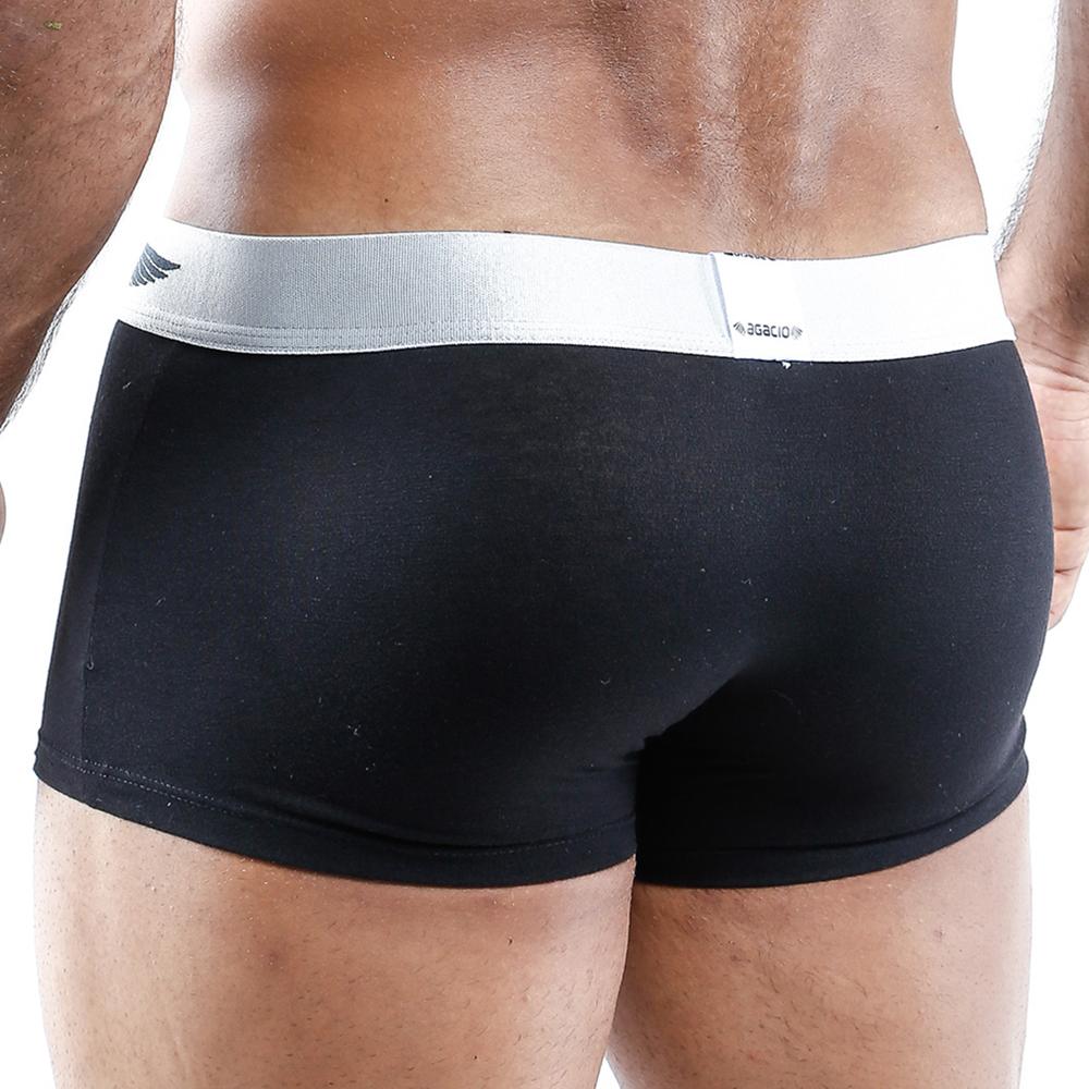 A close-up image displays the Agacio Boxer Trunk from the waist down, highlighting its silky fabric and contour pouch. The black trunks feature a sleek white waistband, set against a plain background.