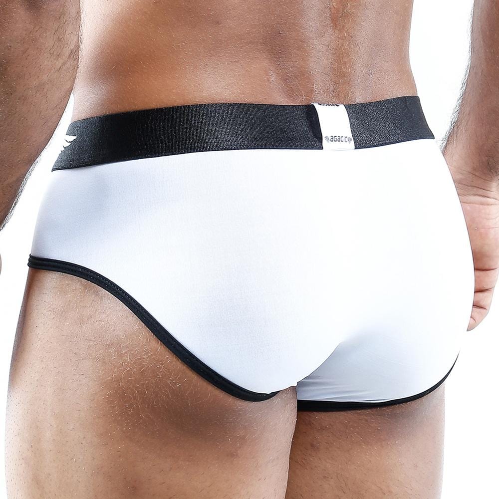 Someone wearing Agacio Structure Bikini Briefs, recognized for their masculine style and supportive design, with a black waistband is seen from the back against a plain white background.
