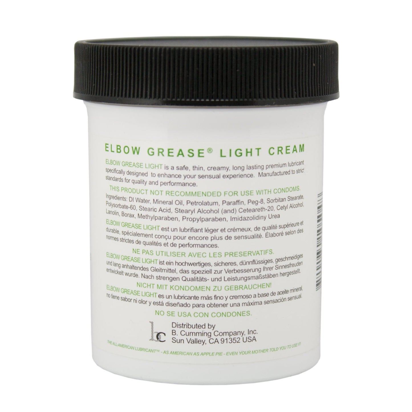 The Elbow Grease Light Cream, in a white jar, promises a silky glide and is aimed at enhancing sensual experiences. It contains mineral oil, so do not use with condoms. Company details and distribution address are listed at the bottom.