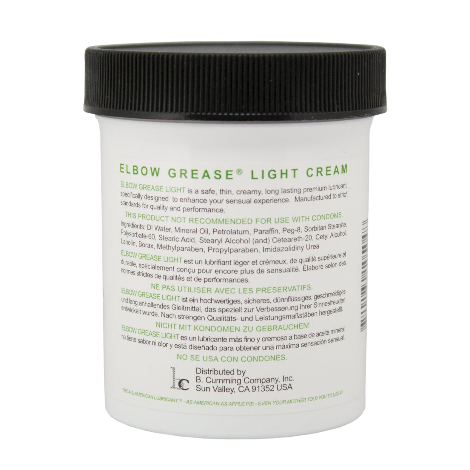 The Elbow Grease Light Cream, in a white jar, promises a silky glide and is aimed at enhancing sensual experiences. It contains mineral oil, so do not use with condoms. Company details and distribution address are listed at the bottom.