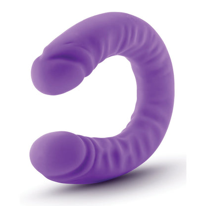The Blush Ruse 18 Slim Double Dong by Blush Novelties is a purple, C-shaped silicone dildo with smooth and textured surfaces. Featuring rounded, bulbous tips at both ends, it offers versatile play options and is photographed against a white background. Body-safe silicone ensures safe use.