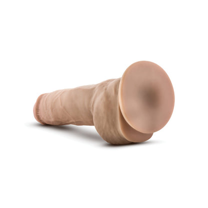 The Blush Au Naturel 10 Big Boy Realistic Dildo by Blush Novelties features Dual Density silicone for a realistic feel, with a smooth surface, flared base for safety, and a suction cup base for versatile use.