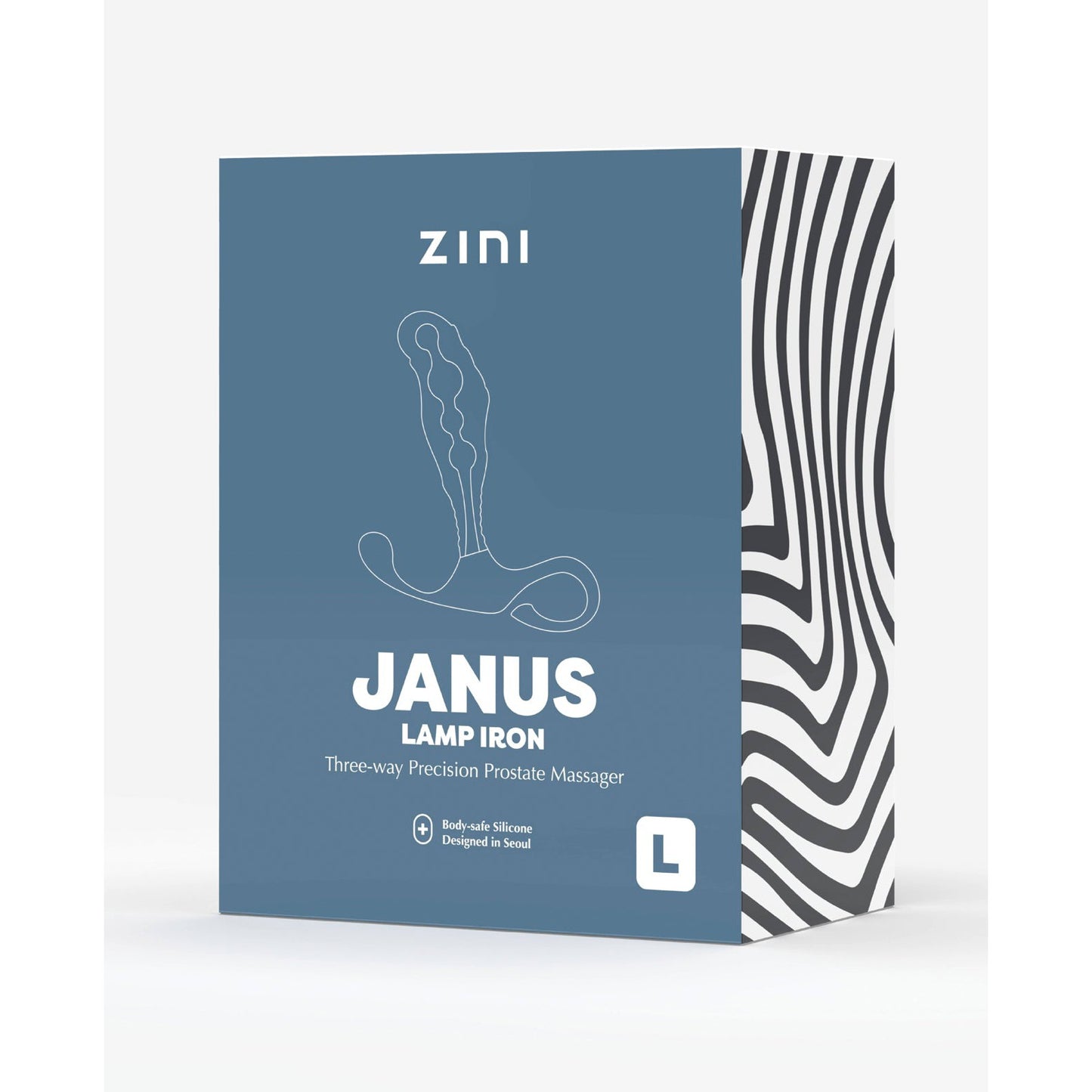 The image depicts a box labeled Zini Janus Lamp Iron by Zini, featuring a three-way precision prostate massager made from body-safe silicone. The blue packaging with white text includes a stylized illustration and a bold, striped black-and-white side panel.