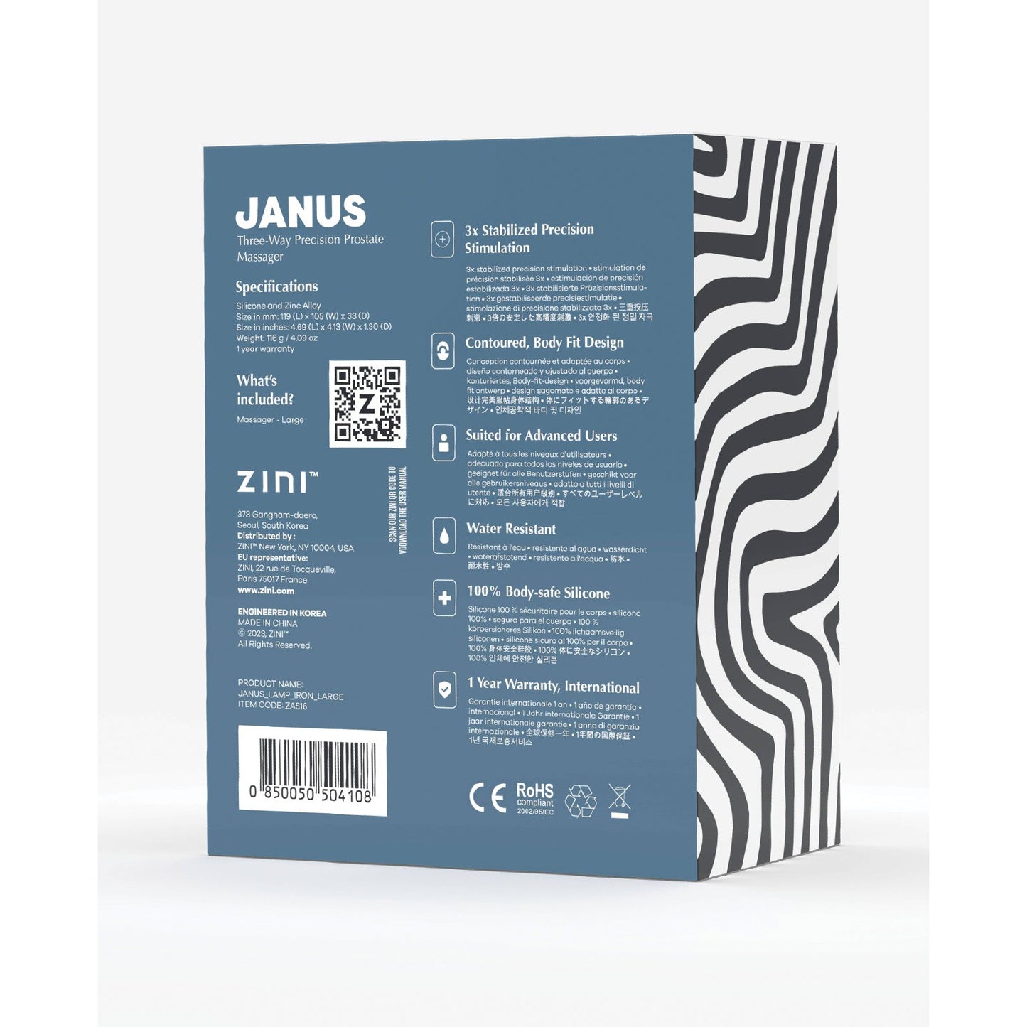 The image shows the back of the Zini Janus Lamp Iron massage device box, featuring a blue and white design with specifications, included items, contact info, and warranty details. Made from body-safe silicone, it boasts a wavy black and white pattern on the side.