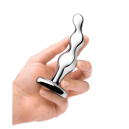 A hand holds b-vibes Stainless Steel Anal Beads, featuring a wavy design and flat base, against a white background.