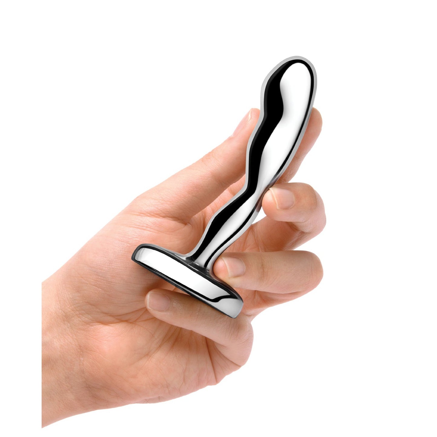 A hand holds the b-vibe Stainless Steel Prostate Plug, a sleek personal massager with a flat base. The body-safe design boasts a curved, stainless steel shape and a shiny, reflective surface.