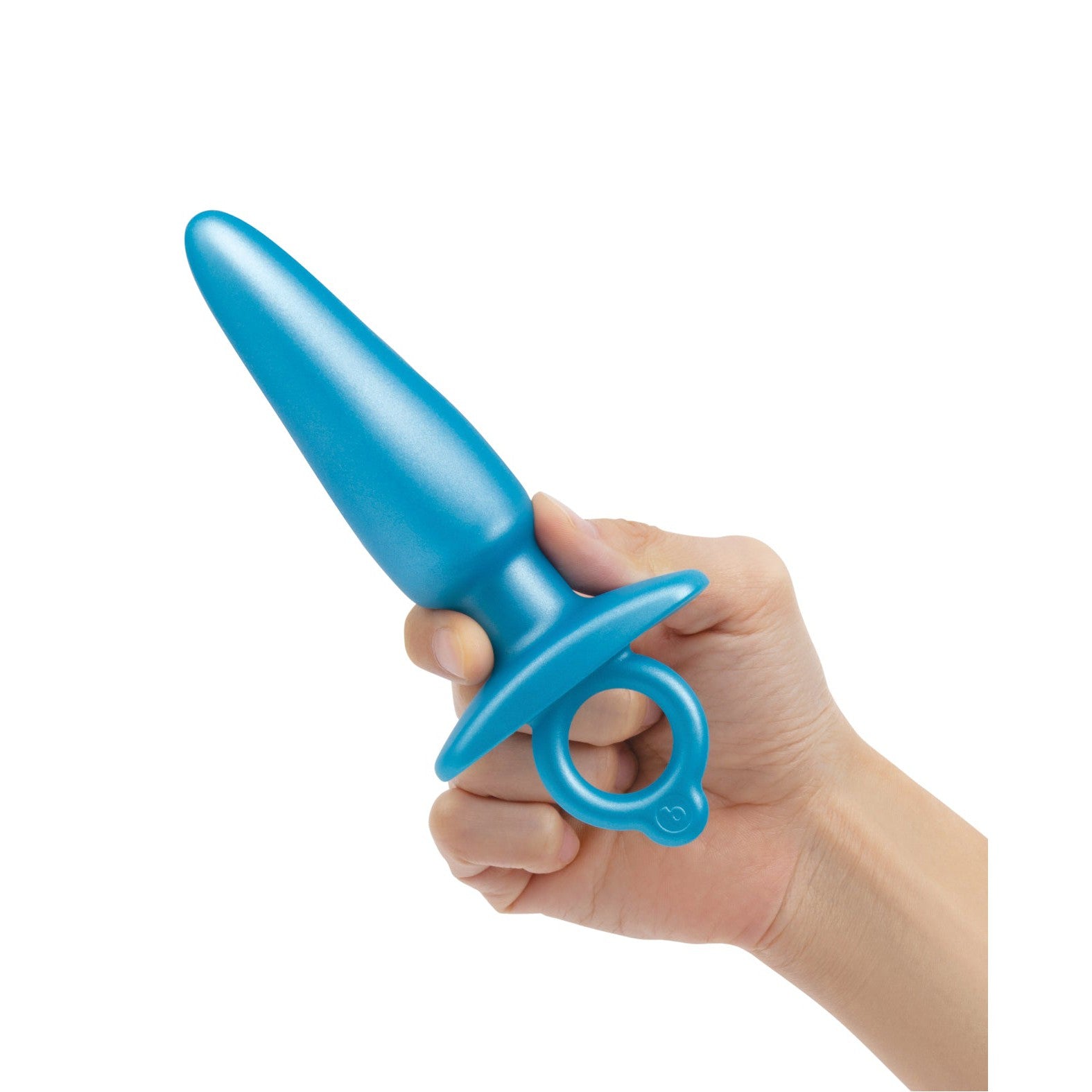 A hand holds the b-Vibe Butties Sleek Tapered Plug from BV-075, made of body-safe silicone. The blue, smooth plug with a flared base and finger loop ensures security and comfort during anal training, set against a pristine white background.