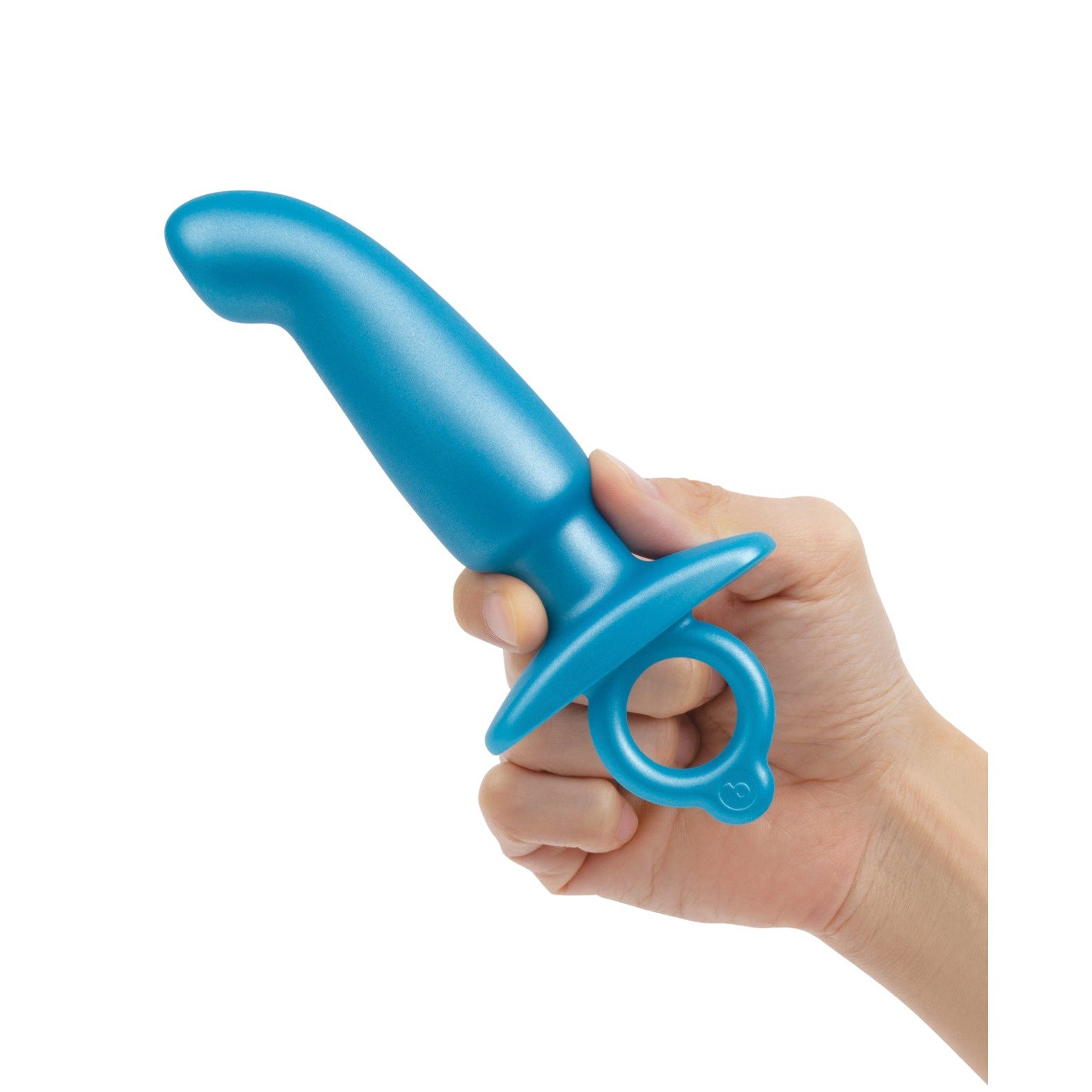 A hand holds the b-Vibe Butties Hither Tapered Prostate Plug, a blue silicone plug by b-vibe, featuring a flared base and ring handle for ideal P-spot stimulation.