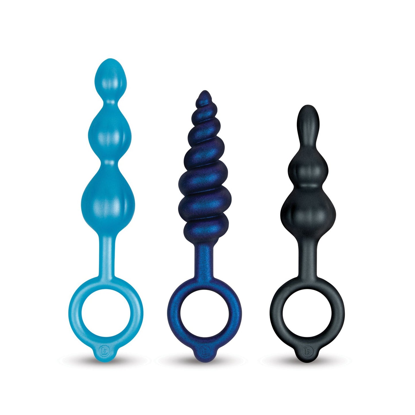 The b-vibe Butties Beaded Bundle includes three silicone plugs in blue, dark blue, and black. Each features unique textures—beads, spiral ridges, and smooth curves—with ring handles for enhanced anal play or training.