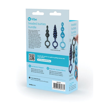 The b-Vibe Butties Beaded Bundle packaging showcases three silicone beaded plugs in different sizes and colors, ideal for anal training and play. The box back includes product details, features, and a QR code for further information.