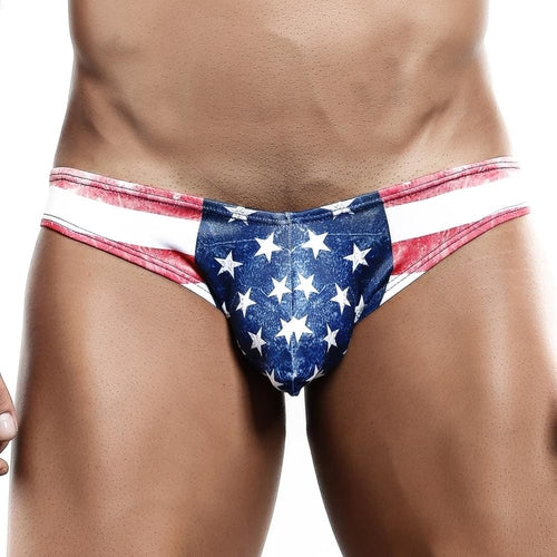 Someone is wearing the Cover Male USA Flag Bikini Brief, proudly displaying stars and stripes. Made by Cover Male, these swim briefs combine comfort and style with a high-quality fabric blend against a plain white background.