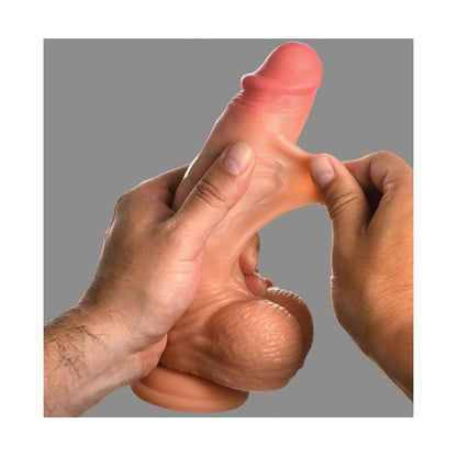 Someone holding the Curve Toys Jock Real Skin Silicone 8 Dildo With Balls by Curve Novelties, showing its flexible texture with both hands against a plain backdrop.