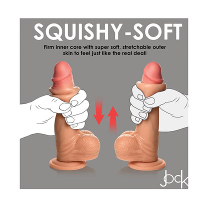 An image shows a hand squeezing the Curve Toys Jock Real Skin Silicone 8 Dildo With Balls, featuring dual-density silicone. Text emphasizes the firm cores support, with arrows demonstrating its squeezable nature. This Curve Novelties product has a realistic stretchable skin for enhanced pleasure.