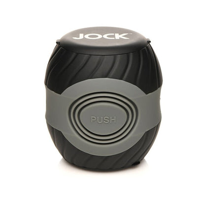 A black and gray cylindrical item labeled JOCK on top, the Curve Toys Jock 10x Vibrating Double Masturbator by Curve Novelties features a ribbed design and a PUSH button in the center, offering 10 vibration modes for enhanced experiences.