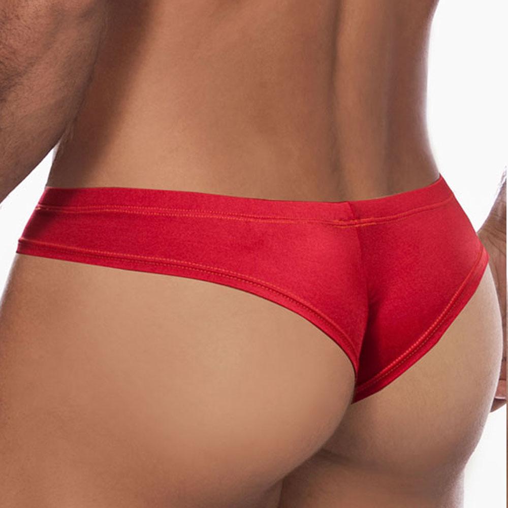 Someone is wearing the Daniel Alexander Emotion Slip Thong in red, featuring a cheeky design, against a white background. The emphasis is on the lower back and waist, highlighting the premium fabric blend for ultimate comfort and style.
