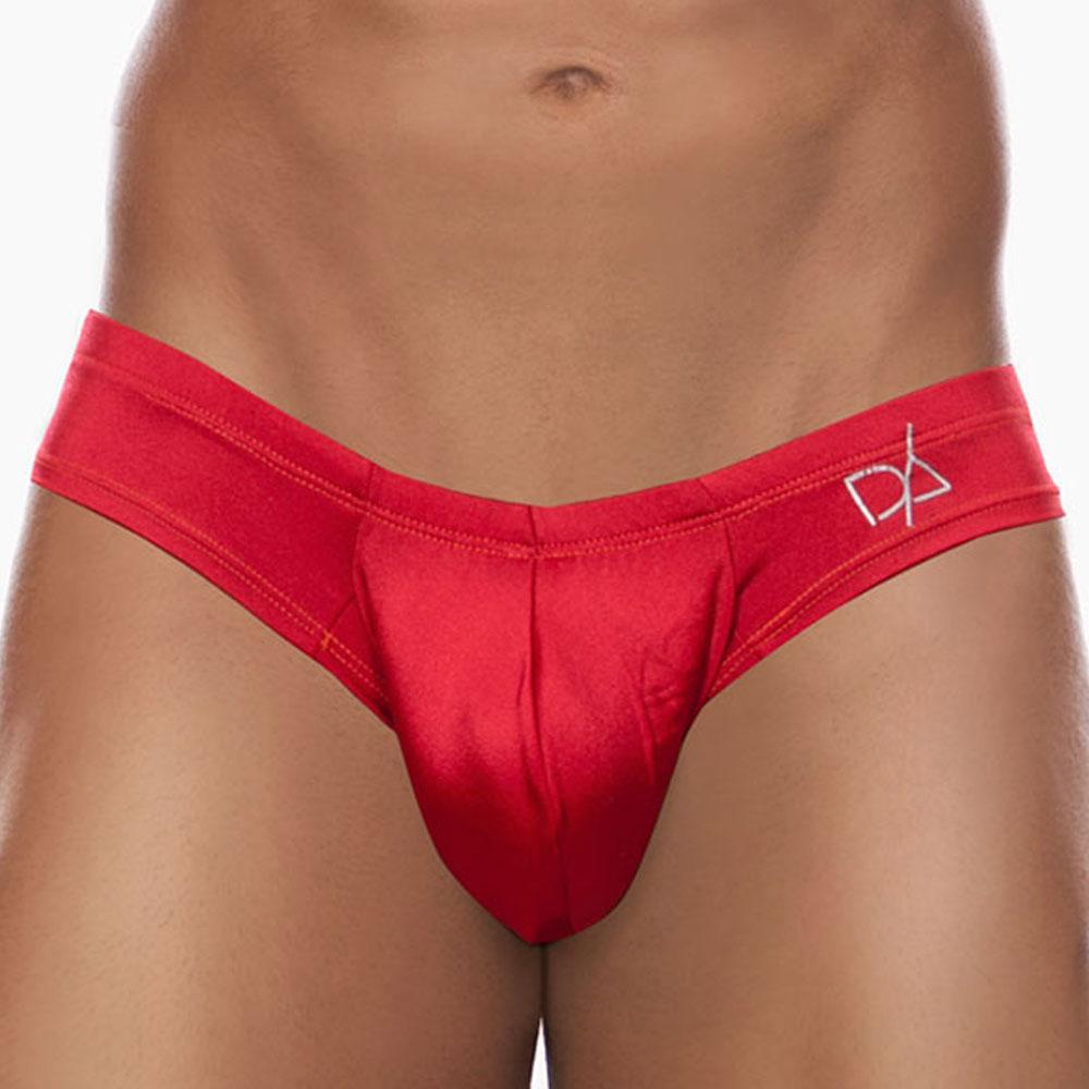 A person wearing the Daniel Alexander Emotion Slip Thong in red, featuring a cheeky back design and a white logo. The background is plain white.