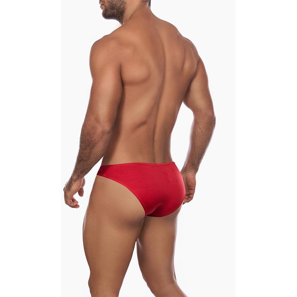 A muscular person is seen from the back against a white background, wearing a vibrant red Daniel Alexander Colorful Slip bikini.