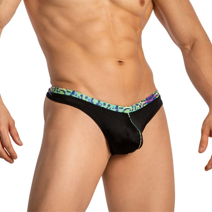 A person exudes confidence wearing Daniel Alexander Thongs for Men with Leopard Print, featuring a stylish colorful waistband. The plain background highlights the second-skin comfort and perfect fit of this Daniel Alexander underwear.