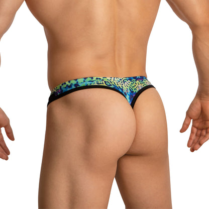 A person is seen from the back in Daniel Alexander Thongs for Men with Leopard Print, exuding confidence. Their arms rest naturally at their sides against a crisp white background, epitomizing second-skin comfort by Daniel Alexander.