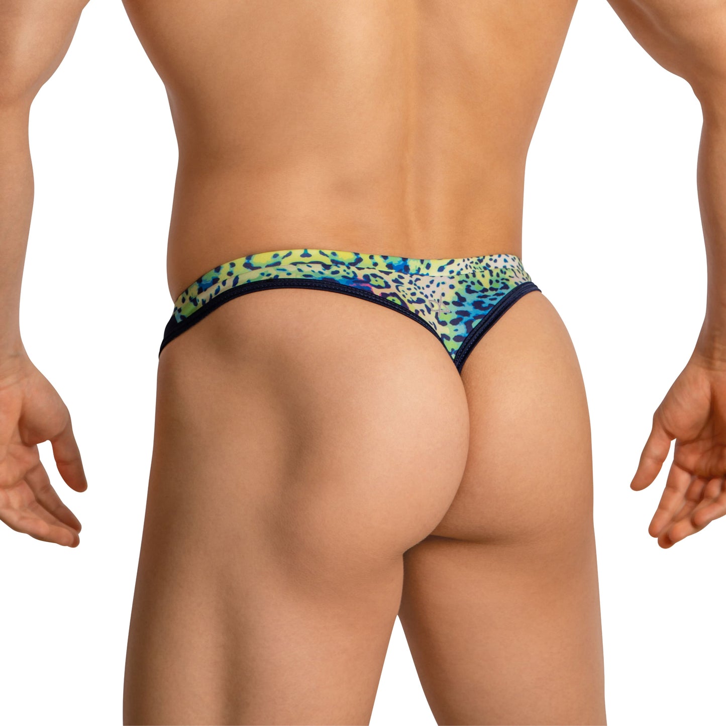 A person is confidently wearing Daniel Alexander Thongs for Men with Leopard Print, showcasing their physique with second-skin comfort against a plain white background.