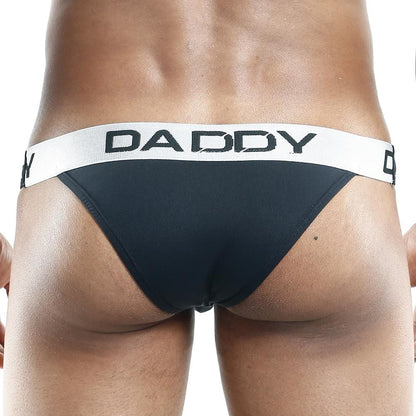 Rear view of a person wearing the Daddy Slip Bikini, showcasing a white waistband with DADDY boldly printed in black for a sexy flair.