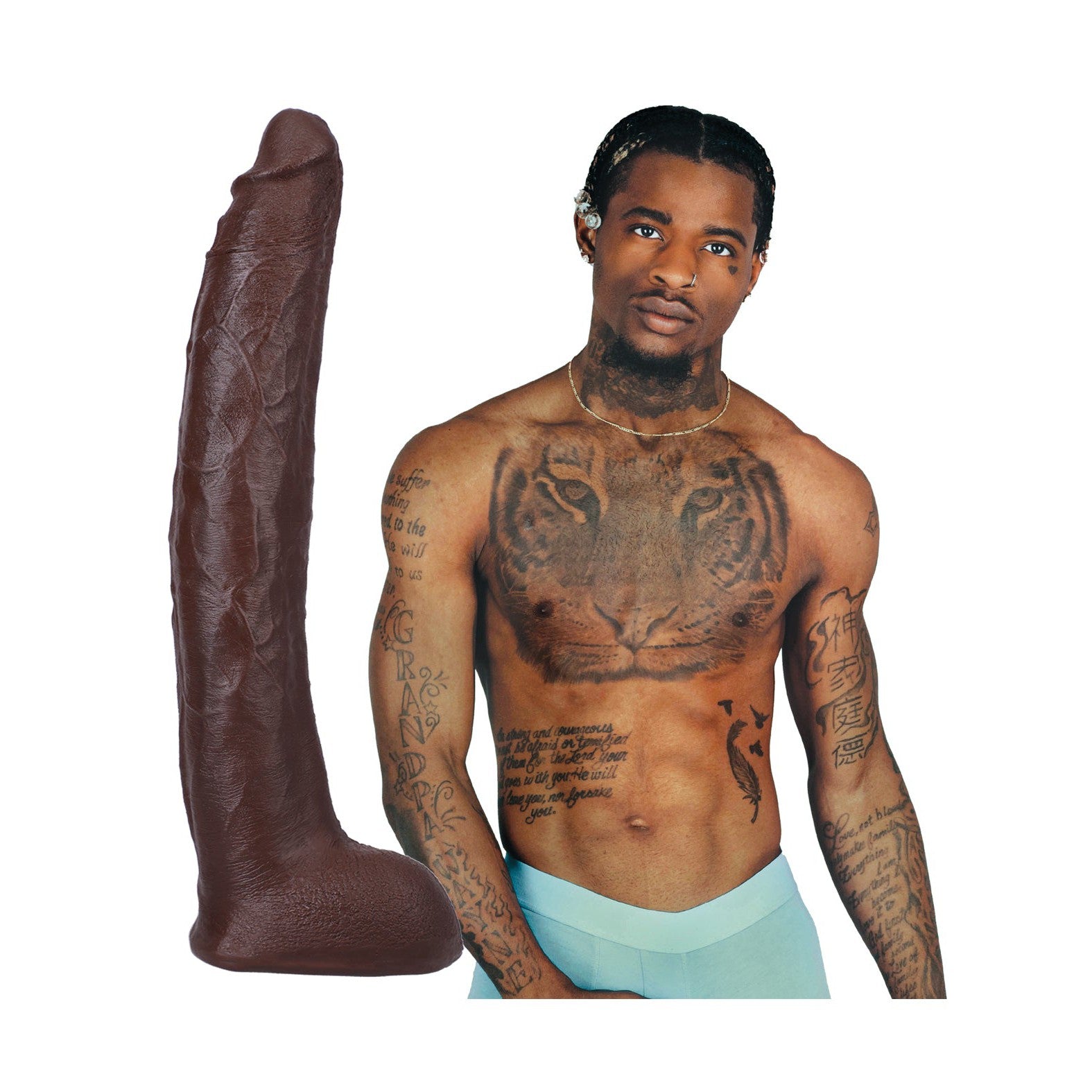 A tattooed, shirtless man with short, braided hair and light blue pants stands next to the Signature Cocks ULTRASKYN 12 Cock - Damion Dayski by Doc Johnson, highlighting its lifelike appearance. The large dark brown object resembles a sculpted pillar against a plain white background.
