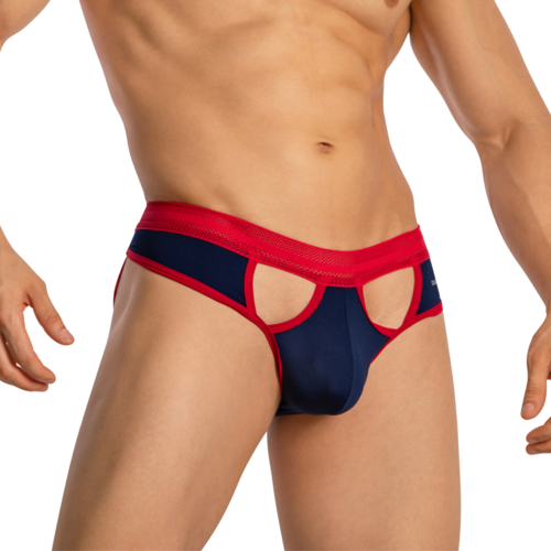 A person wears the Daddy Revealing Stylish Jockstrap, featuring navy and red premium fabric with cut-out details and bold red trim, highlighting the torso and thighs to embody Daddys distinctive style while keeping the face hidden.