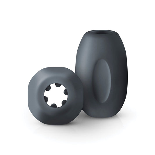 Explore the Boners Hand Job Stroker set: two dark gray ultra-soft cylindrical toys. One has a smooth surface with an oval indentation; the other offers a circular opening and inner protrusions for intense stimulation.