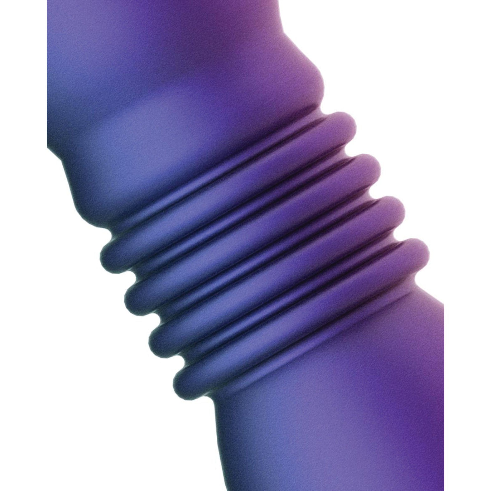 Close-up of the Hueman Supernova Thrusting Butt Plug, showcasing its purple, ribbed, and curved design. The lighting emphasizes the smooth matte finish of its waterproof material, inviting exploration of its subtle vibration patterns.