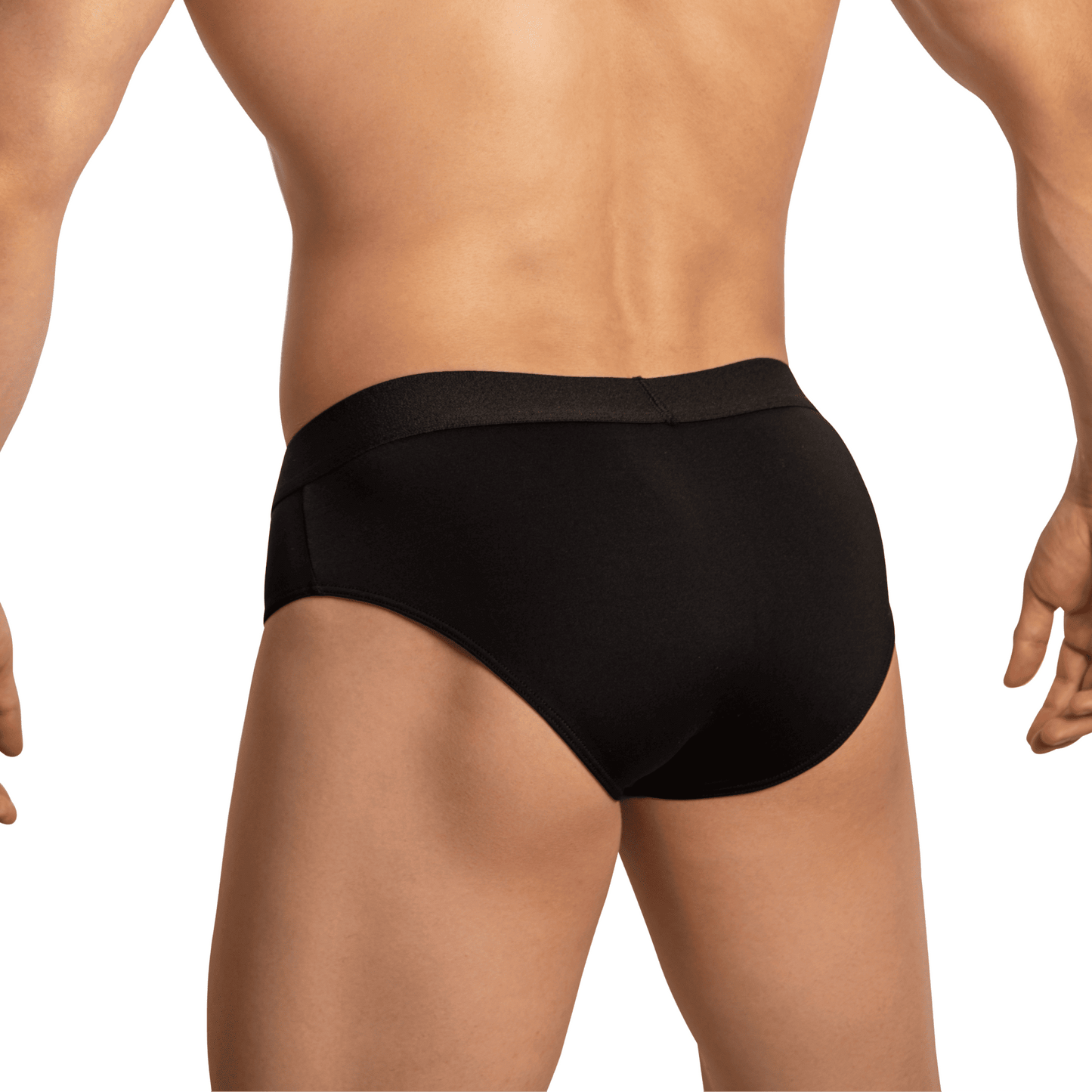 A person wearing Edipous Briefs for Men Open Front stands with their back turned, highlighting the seductive design and minimal coverage, emphasizing the fit and allure across the lower torso and upper legs.