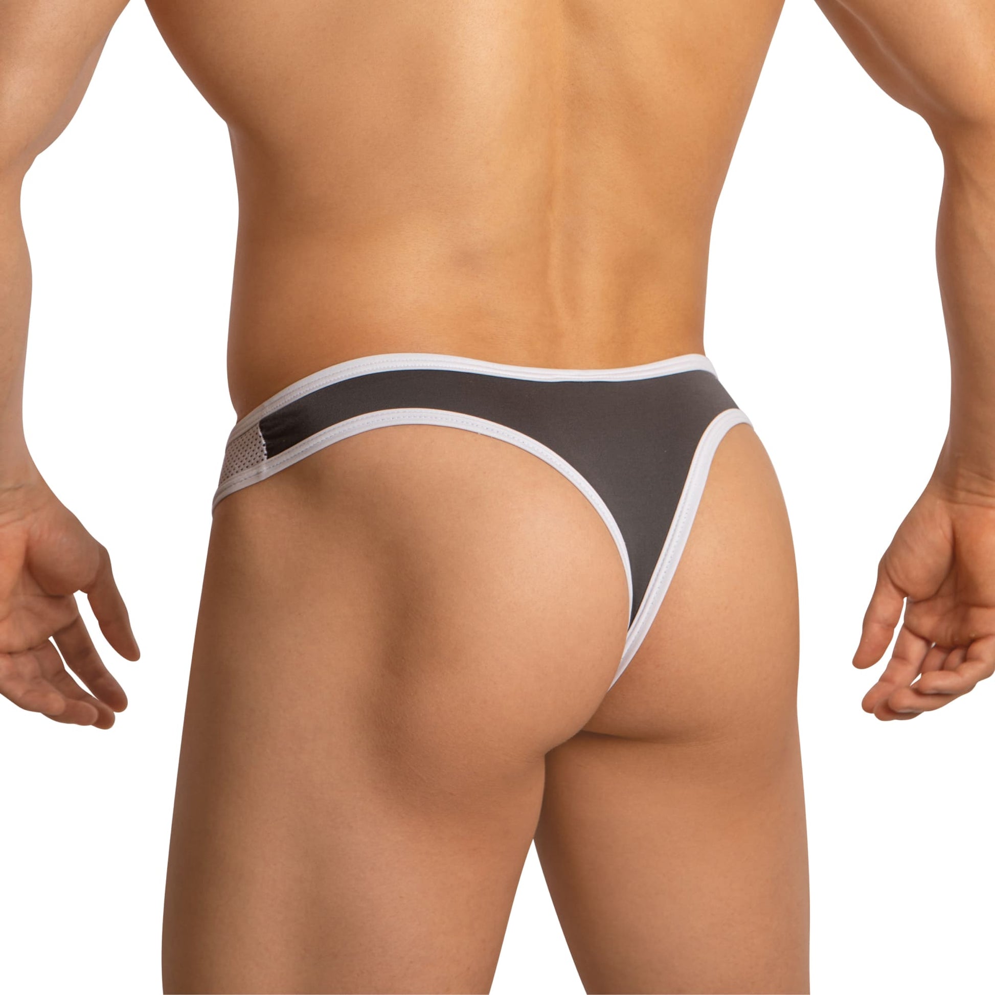 The image features the back view of a person wearing Edipous Mens Thong with an asymmetrical cut. This stylish black and white piece includes a wide waistband and is set on a plain white background.