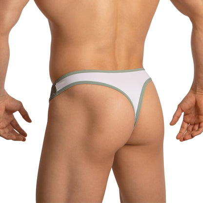 A person models the Edipous Mens Thong with Asymmetrical Cut, showcasing its stylish design, thin waistband, and minimal coverage. Photographed from the back against a plain white background, their lower back and arms are visible.
