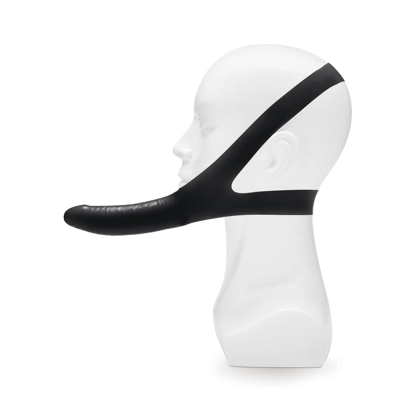 The Lux Fetish The Original Facilitator by LUX is displayed on a white mannequin head, featuring a travel-friendly black head strap with a cylindrical mouth extension that looks like a novelty chin-mounted dildo mask. Its hands-free design stands out against the plain white background.