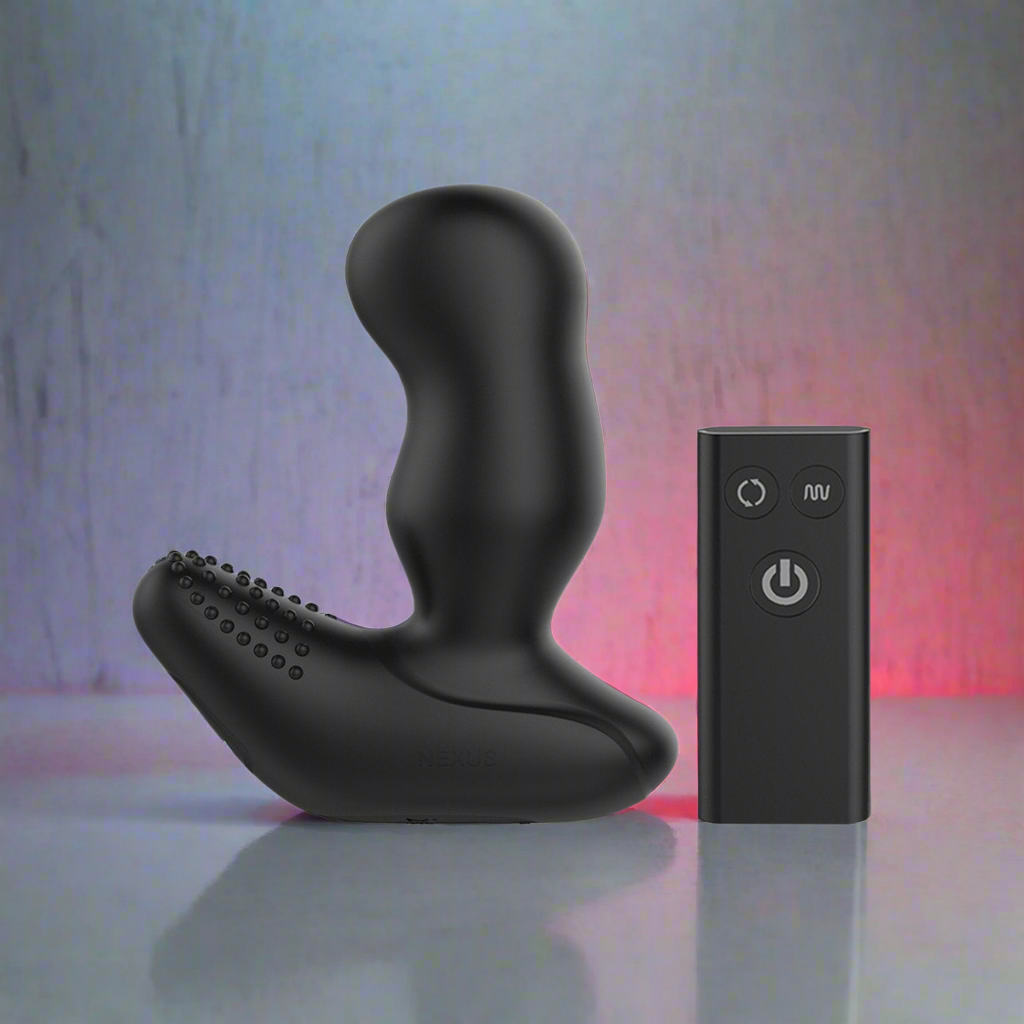 The Nexus Revo Extreme by Nexus is a black, ergonomically styled prostate massager with a textured surface and waterproof design. It accompanies a small black remote with power and function buttons, all set on a textured blue-red gradient background.