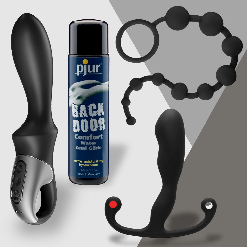 The Prostate Royalty set by Adams Toy Box includes a black vibrator, Aneros Helix Syn Trident, Pjur Back Door lubricant, black anal beads, and a sleek prostate massager against a gray and white background.