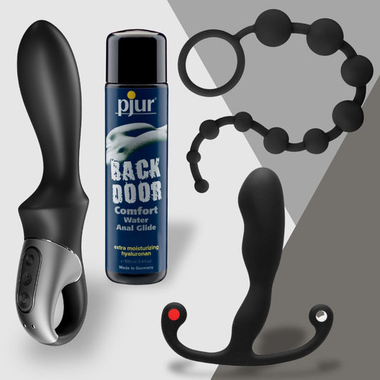 The Prostate Royalty set by Adams Toy Box includes a black vibrator, Aneros Helix Syn Trident, Pjur Back Door lubricant, black anal beads, and a sleek prostate massager against a gray and white background.