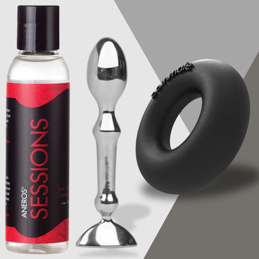 Discover the Slow and Steady Wins the Race set by Adams Toy Box, featuring a bottle of Aneros Sessions lubricant, a bulbous metal anal plug with flared base, and a black silicone cock ring—artfully arranged on a gray geometric background for prolonged pleasure.