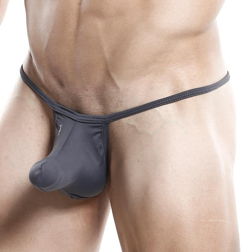 A man with a masculine physique is captured against a plain backdrop, wearing the Good Devil G-String. The focus is on his lower torso, showcasing the minimal coverage swimwear style and fabric.